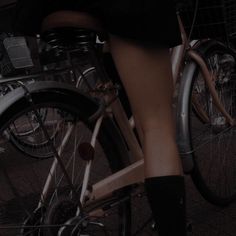 the legs of a woman riding a bike