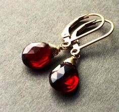 Genuine Garnet earnings, burgundy gold dangles, dark red teardrop jewelry, January birthstone.  Handcrafted with natural red Garnet Stones.  Petite, minimalistic and lightweight.  Real Untreated Garnet stones (8 x 6 mm) faceted teardrop shape gems wire wrapped and suspended on leverbacks.  Length is about 1" long.  Each pair of gems is unique and one of a kind, they are untreated and natural stones, expect some imperfections. These beautiful earrings will be a nice gift for a female that like mo Red Elegant Nickel-free Teardrop Earrings, Red Garnet Wire Wrapped Earrings, Red Garnet Dangle Earrings, Red Garnet Teardrop Earrings, Red Garnet Drop Jewelry, Red Teardrop Garnet Earrings, Teardrop Garnet Red Jewelry, Red Teardrop Gemstone Jewelry, Faceted Teardrop Red Jewelry