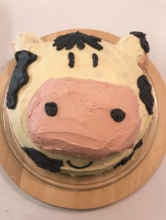 a cake shaped like a cow is on a plate