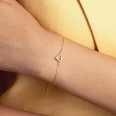 CZ Heart Bracelet in 14k Real Gold for Women - Heart Charm Bracelet - Mini Heart Bracelet - Love Bracelet - Everyday Bracelet - Gift for Her When you can't hold her hand, a little gift goes a long way. The tiniest of details can be the symbol of love. Simple is the way to go, and huge is the way to love. D E T A I L S   * Made to Order. * 100% 14k Solid Gold * Choice of Gold Color: Yellow Gold, Rose Gold, White Gold * Gemstone: Cubic Zirconia * Charm height: 6 mm/0.23 inch * Charm width: 7 mm/0. Gold Heart Bracelet, Solid Gold Charms, Gold Jewelry Gift, Everyday Bracelet, Handcrafted Bracelets, Love Bracelet, Mini Heart, Fine Jewelry Gift, Love Bracelets