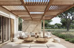 an outdoor living area with couches and tables