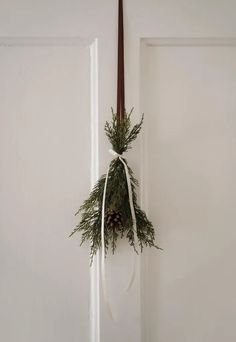 a door with a wreath hanging on it's side