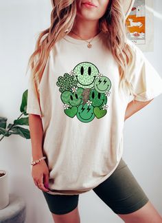 Comfort Colors Shirt\ St Patty's Day Green Smile T-Shirt, Smile Face St Patrick's Day T Shirt, St Patricks Day Love Smile Clover Hearts Tee 👉Experience the soft, vintage touch and a laid-back fit with Comfort Colors T-Shirts.  Crafted from 100% ring-spun cotton for ultimate comfort. To achieve an oversized look, we recommend sizing up by two sizes. ✨Care Instructions✨ 👉Wash item inside out in cold water, do not bleach, do not dry clean, do not iron directly on the design. ✨How To Order✨ 👉 Fir Green Crew Neck T-shirt With Heart Graphic, Cute Green Crew Neck T-shirt, Saint Patties, Heart Tee, Comfort Colors Shirt, St Pattys, St Pattys Day, Smile Face, St Patricks