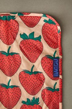 an oven mitt with strawberries on it