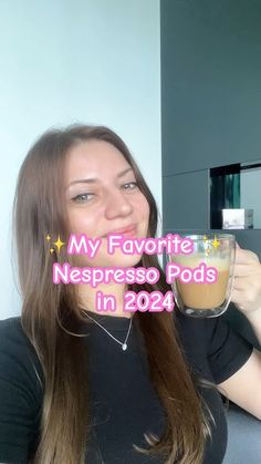 a woman holding up a cup of coffee in front of her face with the caption, my favorite necesso pods in 2020