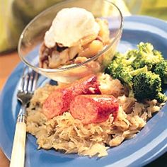 a blue plate topped with meat and veggies