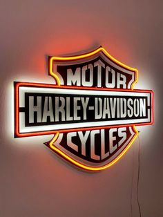 harley davidson neon sign mounted on the wall