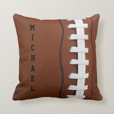 a football pillow with the words michael on it and an image of a football in black ink