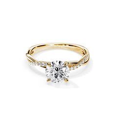 a yellow gold engagement ring with diamonds