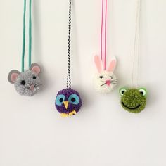 three ornaments are hanging on the wall with one animal and two other animals attached to it