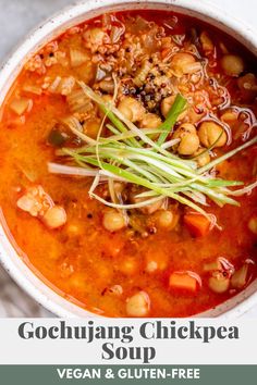 a white bowl filled with soup and vegetables