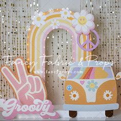 an assortment of decorative items displayed on a shelf in front of sequins and curtains