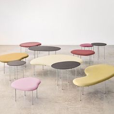 a bunch of tables with different colors on them