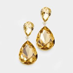 Light Topaz Crystal Double Teardrop Dangle Earrings by MiroItem: EarringsVendor: Miro Crystal CollectionColor : Light Topaz, GoldSize : 0.75" W, 1.75" L Fastening: Post BackMetal: Alloy, Lead & Nickle FreeMaterial: Crystal teardrop Theme: Evening, Prom, Pageant, Bridal Crystal Teardrop Earrings, Topaz Crystal, Teardrop Dangle Earrings, Teardrop Earrings, Topaz, Diamond Earrings, Dangle Earrings, Sparkle, Prom