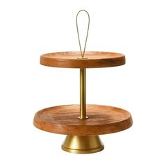 two tiered wooden cake stand with gold metal base and round wood plate on top