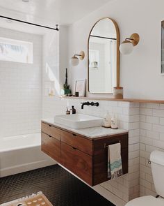 a bathroom with a sink, toilet and bathtub is featured in the article sohlecarpenter / following