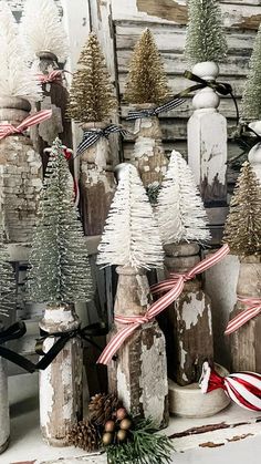 christmas decorations are displayed in front of an old wooden building with snow on the windowsill