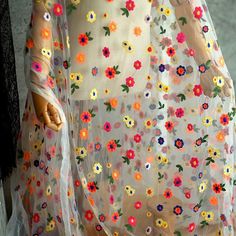 a woman's dress with flowers on it