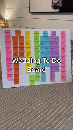 there is a sign that says wedding to do board on the bed with sticky notes