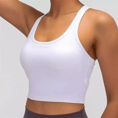 White Racerback Croptop Workout Top Also Available In Blue, Black And Pink. The Item Is Brand New, Never Worn And Comes In Original Clear Packaging. Shop With Confidence - 100+ Positive Reviews! Casual Crop Top With Built-in Bra For Sports, Basic Scoop Neck Sports Top, Basic Sports Top With Scoop Neck, White Scoop Neck Top For Gym, Casual Scoop Neck Sports Bra For Workout, Solid Color Scoop Neck Crop Top For Sports, Solid Scoop Neck Crop Top For Sports, Casual Tank Top With Built-in Bra For Light Sports, Basic White Sports Crop Top