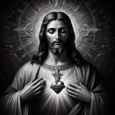 jesus holding the sacred heart with his hands in front of him on a black background