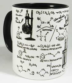 a black and white coffee mug with writing on it