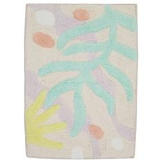 a bath mat with an abstract design on the front and back of it, in pastel colors