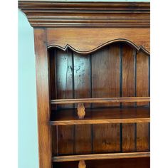 an old wooden bookcase with two shelves