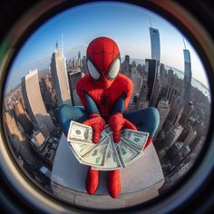 a spider man sitting on top of a building with money in front of his face