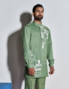 HAND EMBROIDERED SHORT KURTA WITH CONTRAST STITCH DETAILS. LOOKS BEST PAIRED WITH MATCHING TROUSERS.THIS PRODUCT IS HAND EMBROIDERED USING 'AARI' CHAINSTITCH EMBROIDERY, SEQUINS AND GLASS BEADS.MODEL CHEST 40’', WEARING SIZE M, HEIGHT 6'NO. OF GARMENTS: 1 Summer Cotton Kurta With Set-in Sleeves, Casual Eid Sets With Floral Embroidery, Casual Floral Embroidered Sets For Eid, Fitted Cotton Sets With Stand Collar, Casual Embroidered Fitted Sets, Casual Fitted Embroidered Set, Casual Fitted Sets With Embroidery, Embroidered Fitted Sets With Stand Collar, Embroidered Fitted Set With Stand Collar