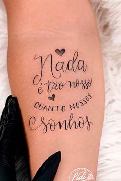 a woman with a tattoo on her leg that says nadda and tatoo