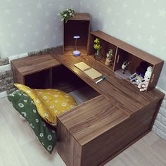 a wooden desk with two open shelves on top