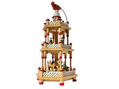 a wooden toy tower with animals and people on it's sides, in front of a white background