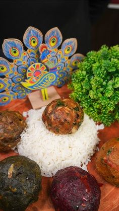 there are several different types of food on the table with rice and broccoli