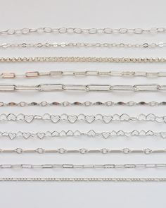 No returns/exchanges on chains. Please note the size or contact us with questions. If you're unsure, we encourage you to order 1 foot as a sample first.  Choose your .925 sterling silver footage chain from 17 styles S1 - 2.6mm cable chain. Great as extender chain to make your pieces adjustable for the wearer. 3.5mm x 2.6mm. Country of origin: USA. (also available in 14k gold filled) S2 - 1.8 flat cable chain. Link length: 2.6mm. Country of origin: USA. Great connector chain for necklaces or pendant necklaces. S3 - 1.5mm rope chain. Country of origin: USA. (also available in 14k gold filled) S6 - 2mm curb chain. Country of origin: USA. Suggested jump ring for permanent jewelry: JR6 (or JR1). (also available in 14k gold filled) S7 - 1.7mm cable chain with tube beads. Country of origin: USA. Silver Flats, Heart Chain, Chain Silver, Rolo Chain, Tube Beads, Paper Clip, Cable Chain, Jewelry Supplies, Chain Link