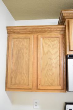 the cabinets above the stove are made of wood