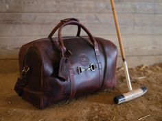 Rugged Leather Duffle Bag, Rugged Distressed Brown Bags With Leather Lining, Rugged Distressed Brown Bag With Leather Lining, Rugged Bags With Leather Lining In Distressed Brown, Vintage Bags With Leather Patch For Travel, Vintage Travel Bag With Leather Patch, Rugged Duffle Bag With Leather Handles, Rugged Oiled Leather Travel Satchel, Rustic Satchel For Travel