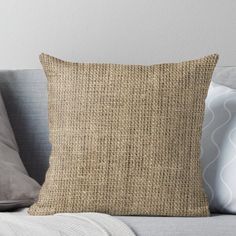 a close up of a pillow on a couch