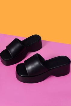 Closed Toe Synthetic Platform Slides, Open Toe Synthetic Platform Slippers With Arch Support, Open Toe Slides With Chunky Platform, Black Platform Slippers With Chunky Platform And Round Toe, Black Chunky Platform Slippers For Summer, Chunky Platform Open Toe Slides, Synthetic Round Toe Platform Slippers With Arch Support, Black Leather Platform Slippers With Thick Bottom, Black Open Toe Platform Slippers