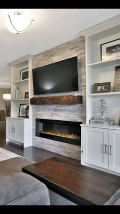 a living room filled with furniture and a flat screen tv mounted on the wall above a fireplace