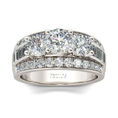 an engagement ring with three stones on the side and two rows of diamonds around it