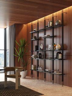 a living room filled with furniture next to a large window and wooden wall mounted bookshelves