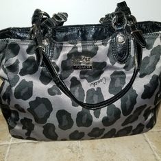 Black N Gray Leopard Print With Wine Interior Coach Gray Shoulder Bag, Gray Shoulder Bag With Handles For Evening, Evening Gray Shoulder Bag With Handles, Coach Gray Bag With Silver-tone Hardware, Coach Bags With Silver-tone Hardware In Gray, Gray Coach Shoulder Bag, Coach Gray Shopping Bags, Coach Gray Shoulder Bag For Shopping, Coach Gray Tote Shoulder Bag