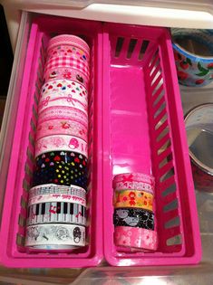 two pink containers filled with different types of washi tapes