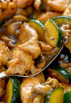 chicken and zucchini stir fry on a spoon