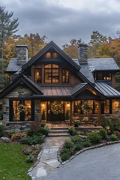 a large house with lots of windows and lights