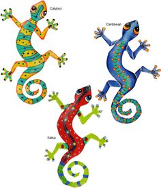 three geckos with different colors and patterns on their body, standing next to each other