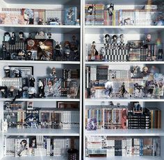 a book shelf filled with lots of books and figurines