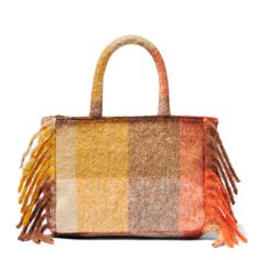 Colette handbagFringes on the sidesDetachable shoulder strapLogo embroidered on the frontOrange and brown all over patternSoft and woolly fabricSizes: 30cm X 22cm X 12cm Multicolor Shoulder Bag For Shopping In Fall, Rectangular Bags With Tassels For Fall, Multicolor Shoulder Bag For Fall Shopping, Fall Multicolor Shoulder Bag For Shopping, Fall Rectangular Bag With Tassels, Rectangular Fall Bag With Tassels, Brown Fringe Bag For Fall, Rectangular Wool Bag For Fall, Wool Rectangular Bag For Fall