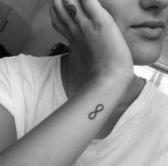 a woman with a small tattoo on her arm